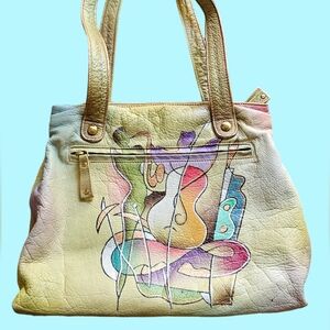 MAGNIFIQUE hand painted leather shoulder bag with music print